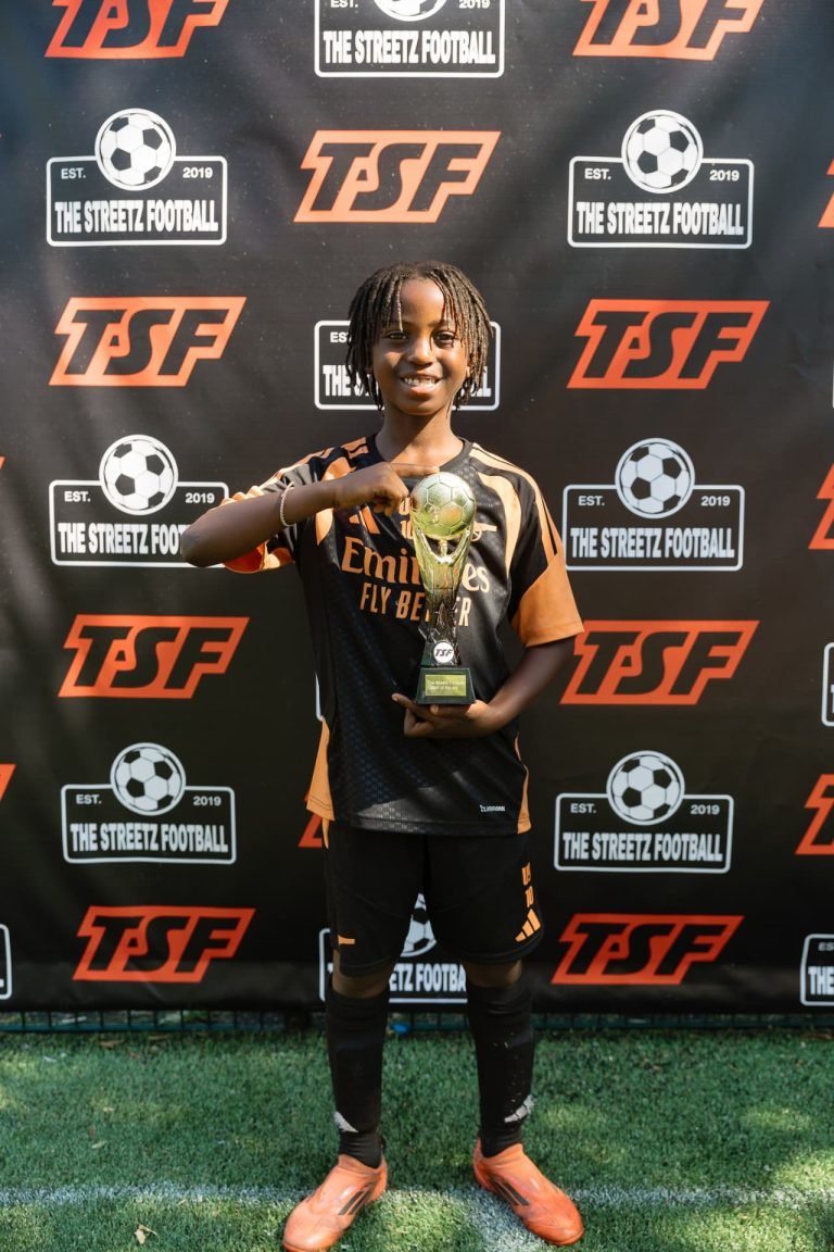 Young TSF player with the player of the day trophy